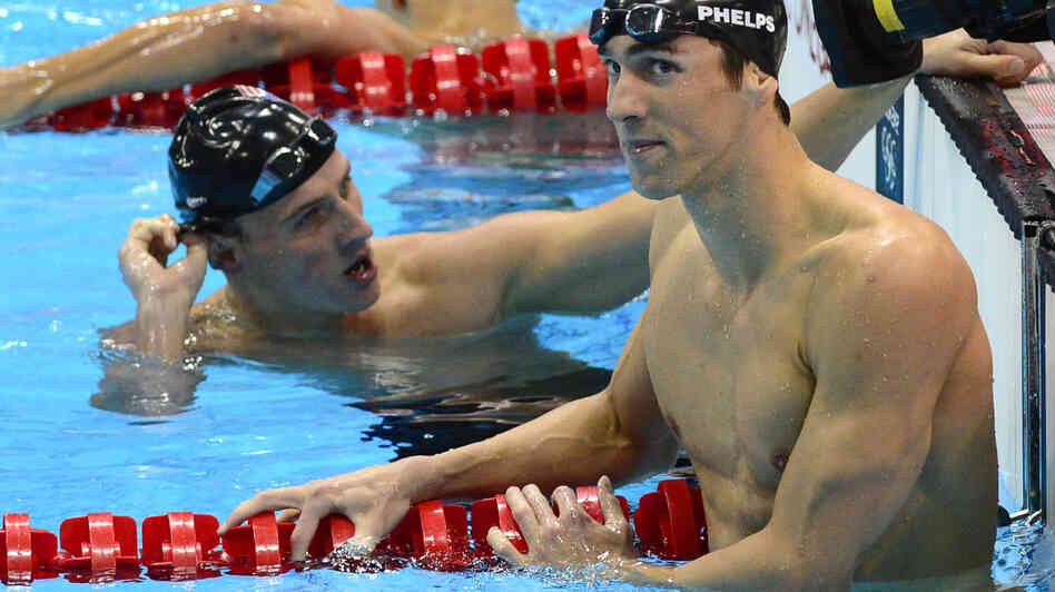 American swimmer Michael Phelps reacts to winning his first individual gold medal at the London 2012 Games. He beat Ryan Lochte (left) in the men's 200m individual medley final. Phelps completed a historic third consecutive 200m IM Olympic victory.