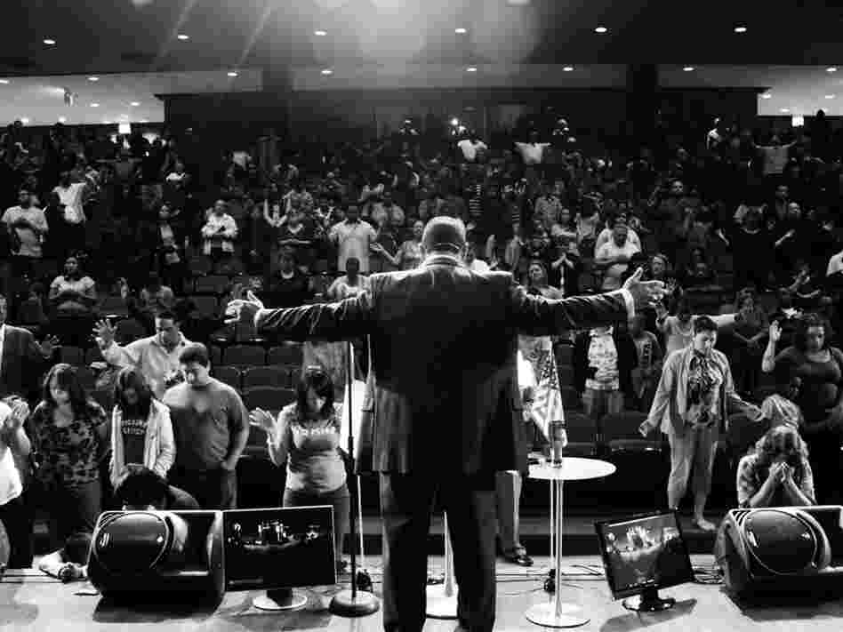 The Rev. Wilfredo de Jesus delivers a sermon at the New Life Covenant Church in Chicago. The church has grown from a congregation of dozens to thousands of families in just a few years.