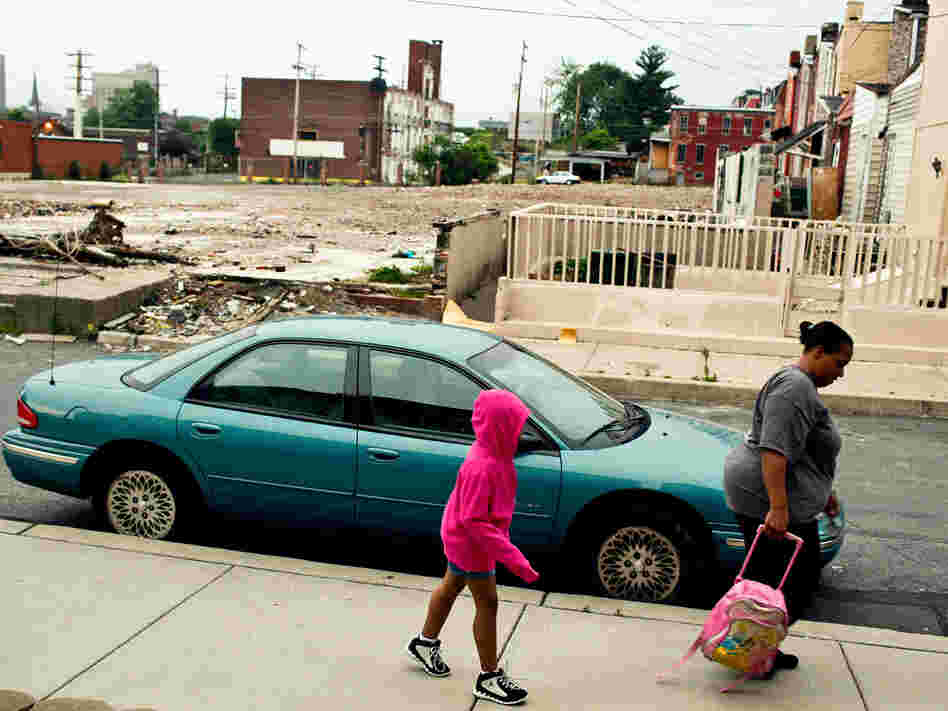 Tracy Boggs, 49, walks her daughter Emily, 7, to the Second Street Learning Center in Reading, Pa., which has been labeled America's poorest city with a poverty rate of 41.3%.