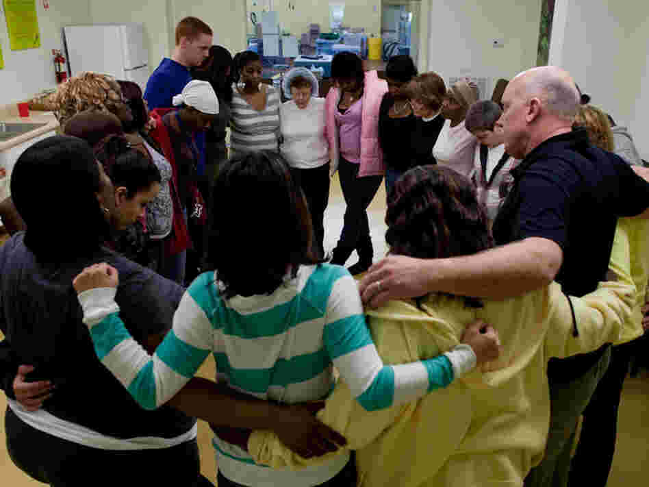 People gather in a support circle at Thistle Farms.