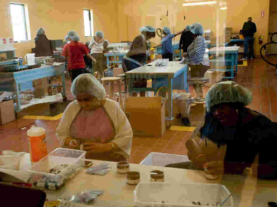 Women at Thistle Farms make body care products by hand and paper from thistles.