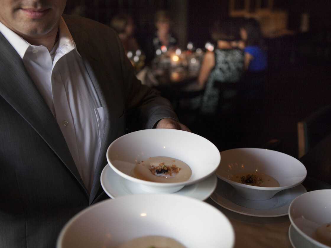 A server at Ardeo+Bardeo shows off potato mousse with a coddled egg hidden inside.