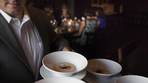 A server at Ardeo+Bardeo shows off potato mousse with a coddled egg hidden inside.