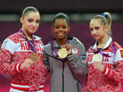 Who's The Happiest? Researchers studied photos of Olympic medalists to learn who is the happiest. Here, bronze medalist Aliya Mustafina of Russia, gold medalist Gabby Douglas of the U.S., and silver medalist Victoria Komova of Russia pose after the all-around gymnastics final. Who's The Happiest? Researchers studied photos of Olympic medalists to learn who is the happiest. Here, bronze medalist Aliya Mustafina of Russia, gold medalist Gabby Douglas of the U.S., and silver medalist Victoria Komova of Russia pose after the all-around gymnastics final.