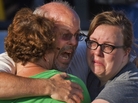 Tom Sullivan embraces family members outside Gateway High School in Aurora, Colo., on July 21. He had been searching for his son Alex, who celebrated his 27th birthday by going to see the new Batman movie at the theater where a gunman opened fire. Tom Sullivan embraces family members outside Gateway High School in Aurora, Colo., on July 21. He had been searching for his son Alex, who celebrated his 27th birthday by going to see the new Batman movie at the theater where a gunman opened fire.