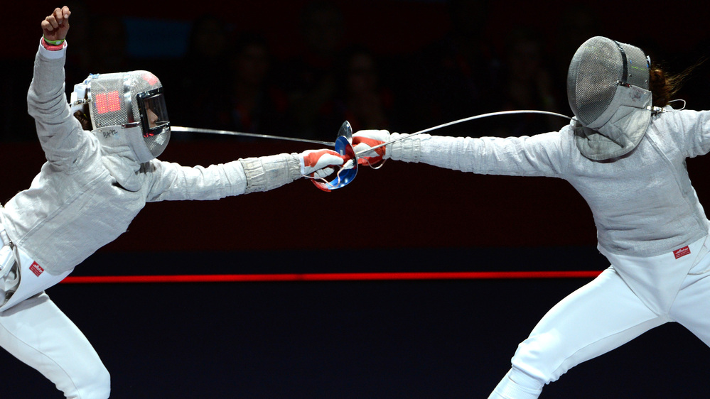Russia's Sofya Velikaya (left) fences against South Korea's Kim Ji Yeon in their sabre gold medal bout Wednesday. Because of a limit on medals, there is no women's team sabre title at the London 2012 Games.