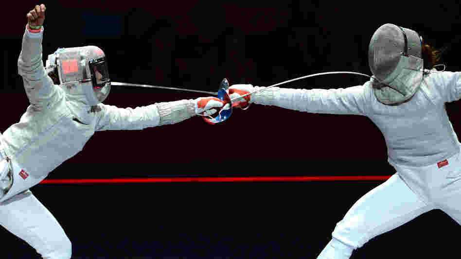 Russia's Sofya Velikaya (left) fences against South Korea's Kim Ji Yeon in their sabre gold medal bout Wednesday. Because of a limit on medals, there is no women's team sabre title at the London 2012 Games.