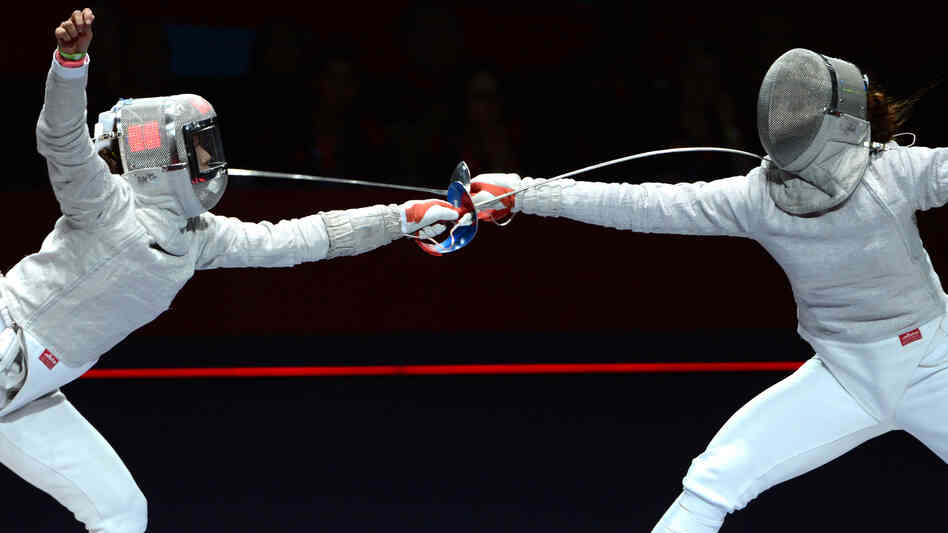 Russia's Sofya Velikaya (left) fences against South Korea's Kim Ji Yeon in their sabre gold medal bout Wednesday. Because of a limit on medals, there is no women's team sabre title at the London 2012 Games.