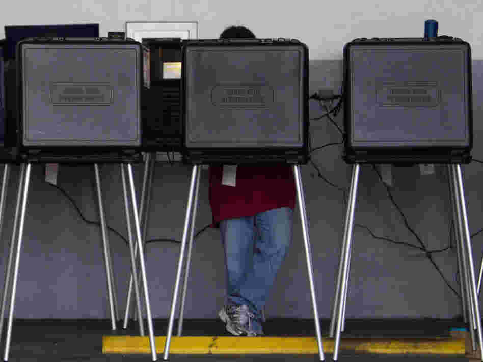A voter casts his ballot in a West Miami, Fla., fire station during the Republican primary in January.