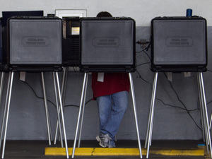 A voter casts his ballot in a West Miami, Fla., fire station during the Republican primary in January. A voter casts his ballot in a West Miami, Fla., fire station during the Republican primary in January.