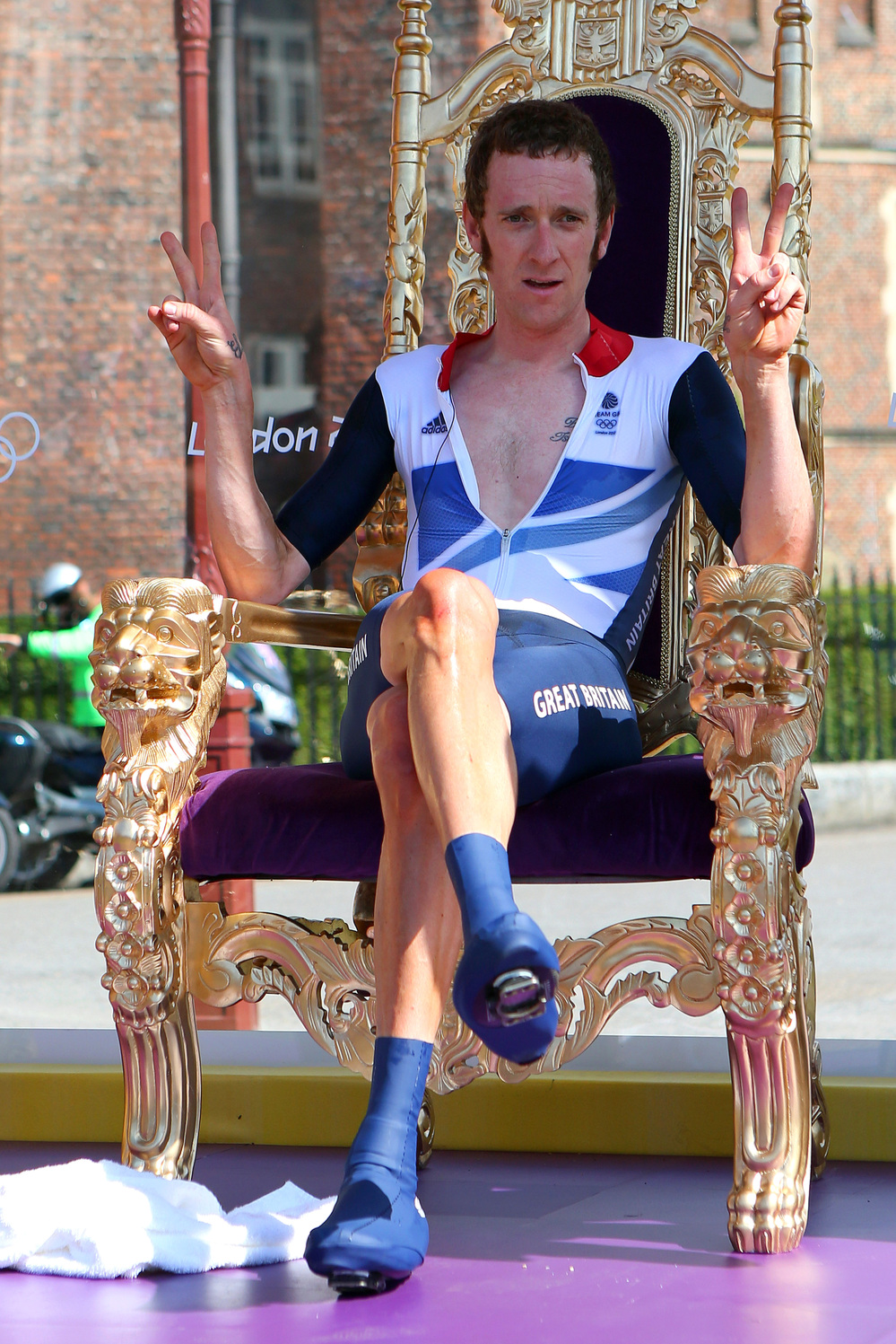 The Mods' New King? Cyclist Bradley Wiggins sits on a chair that looks an awful lot like a throne, after winning an Olympic gold medal Wednesday. Hailed in Britain for his mod tastes and funny tweets, Wiggins celebrated his win by getting "blind drunk," he said.