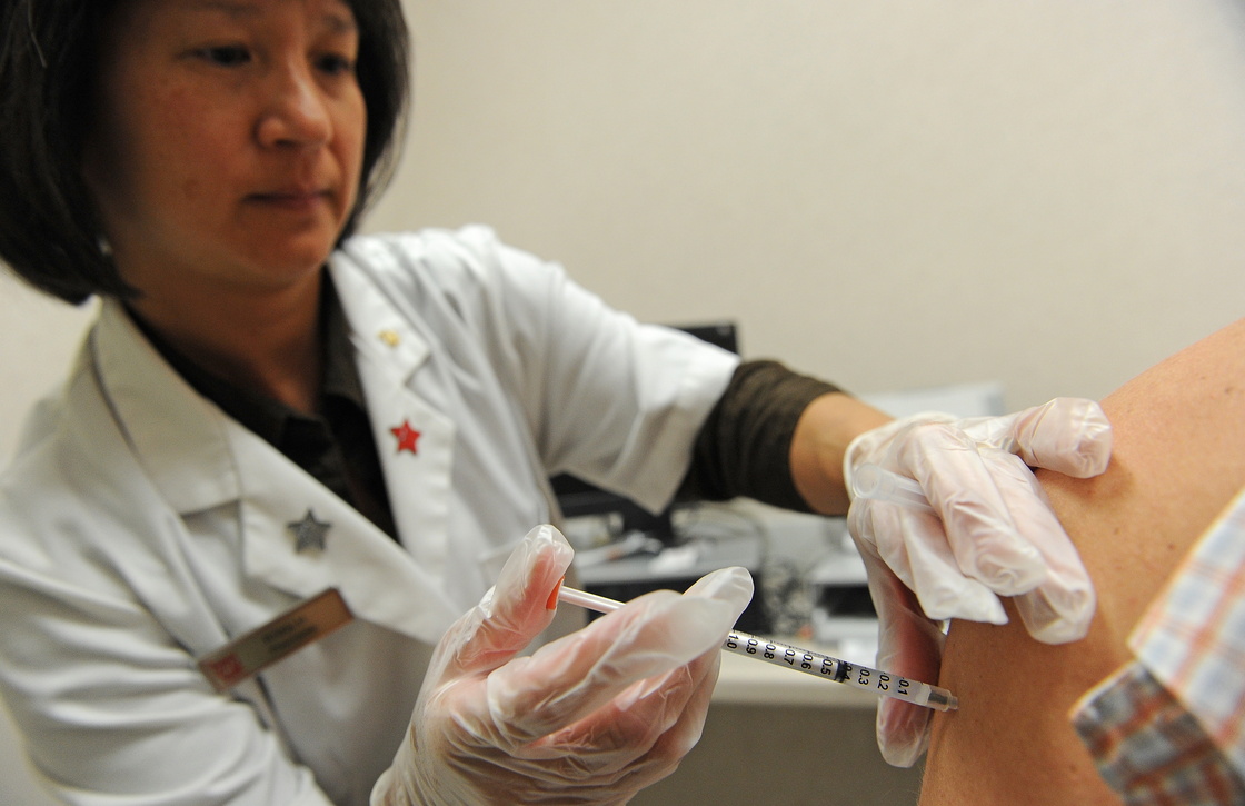 Pharmacist Kristy Hennessee administers a vaccination against whooping cough in Pasadena, Calif., in 2010. Vaccinations are the most powerful weapon for slowing the epidemic, but there are growing concerns that the current vaccine doesn't last as long as expected.