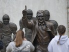 Visitors gather around the statue of former Penn State football coach Joe Paterno outside Beaver Stadium Saturday in State College, Pa. Visitors gather around the statue of former Penn State football coach Joe Paterno outside Beaver Stadium Saturday in State College, Pa.