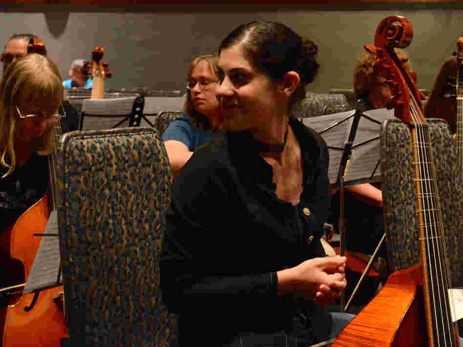 Zoe Weiss, a professional viol player from Boston, checks out the crowd before a performance of Sarah Mead's The Ultimate Fantasy: Ralph Vaughan Williams' Fantasia on a Theme by Thomas Tallis. Zoe Weiss, a professional viol player from Boston, checks out the crowd before a performance of Sarah Mead's The Ultimate Fantasy: Ralph Vaughan Williams' Fantasia on a Theme by Thomas Tallis.