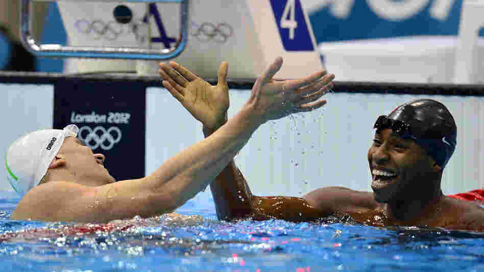U.S. swimmer Cullen Jones (right) won the silver medal in the 50m freestyle. Here, he shakes hands with Brazil's Cesar Cielo after a semifinal heat.