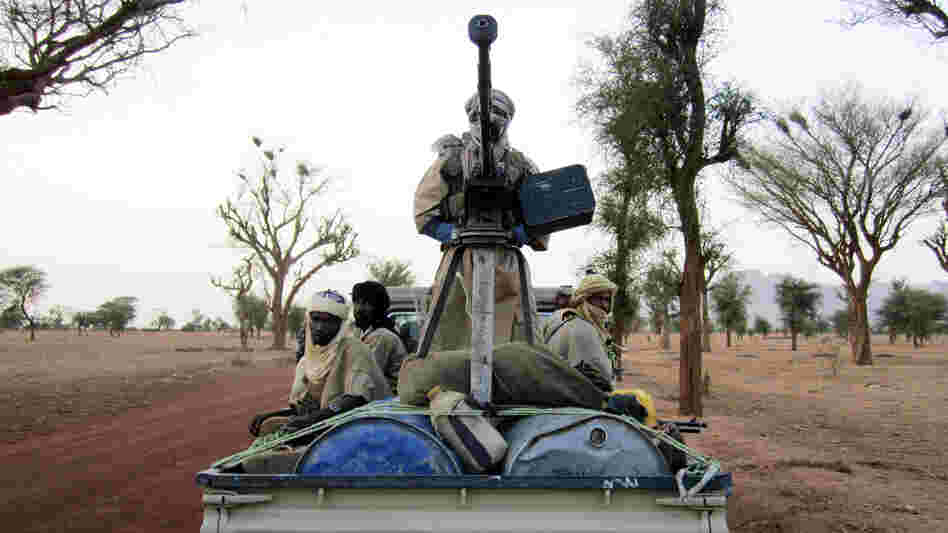 Militiaman from the Ansar Dine radical Islamic group ride on an armed vehicle between Gao and Kidal in northeastern Mali in June. Jihadists currently control the country's north. Militiaman from the Ansar Dine radical Islamic group ride on an armed vehicle between Gao and Kidal in northeastern Mali in June. Jihadists currently control the country's north.