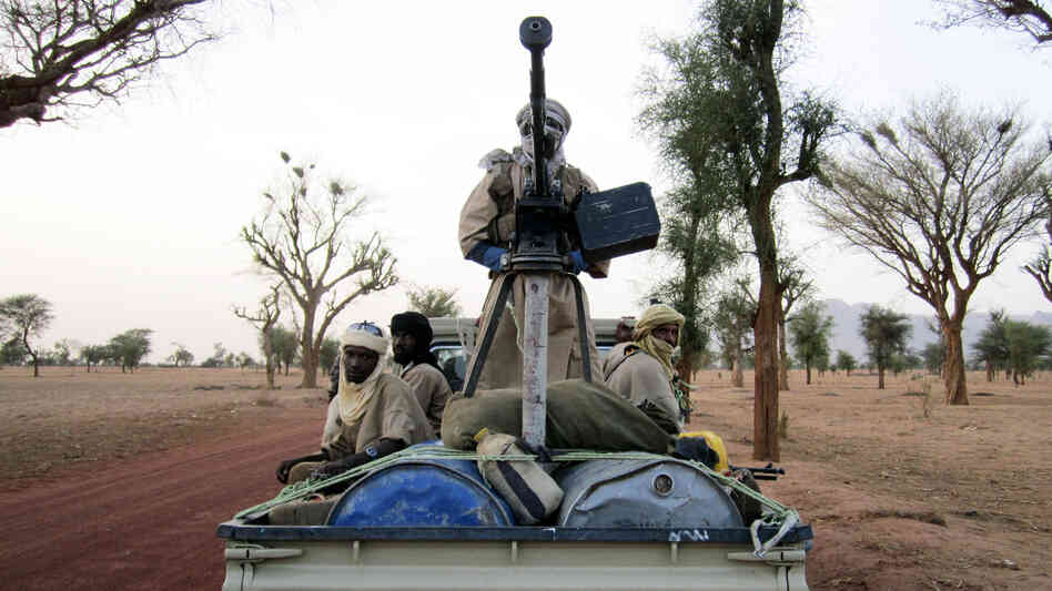 Militiaman from the Ansar Dine radical Islamic group ride on an armed vehicle between Gao and Kidal in northeastern Mali in June. Jihadists currently control the country's north. Militiaman from the Ansar Dine radical Islamic group ride on an armed vehicle between Gao and Kidal in northeastern Mali in June. Jihadists currently control the country's north.
