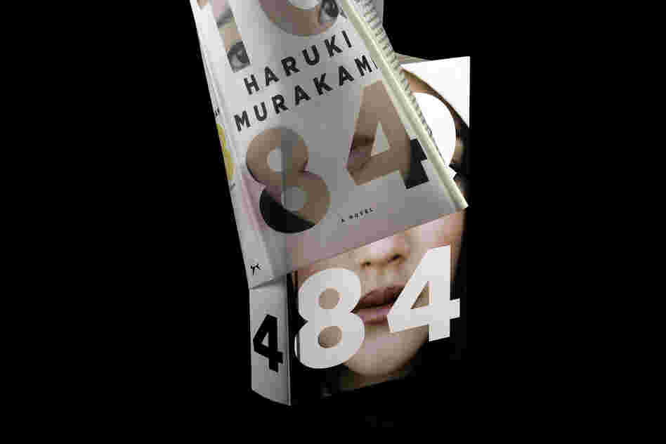 "The jacket is made of a semi-transparent vellum and holds part of the woman's image within the lettering of the title. Underneath is the complimentary image on the binding, and together they 'complete the reality.' Even if you don't know anything about the book when you first see it, you are forced to consider the concept of one person 'stradling' two states of being."