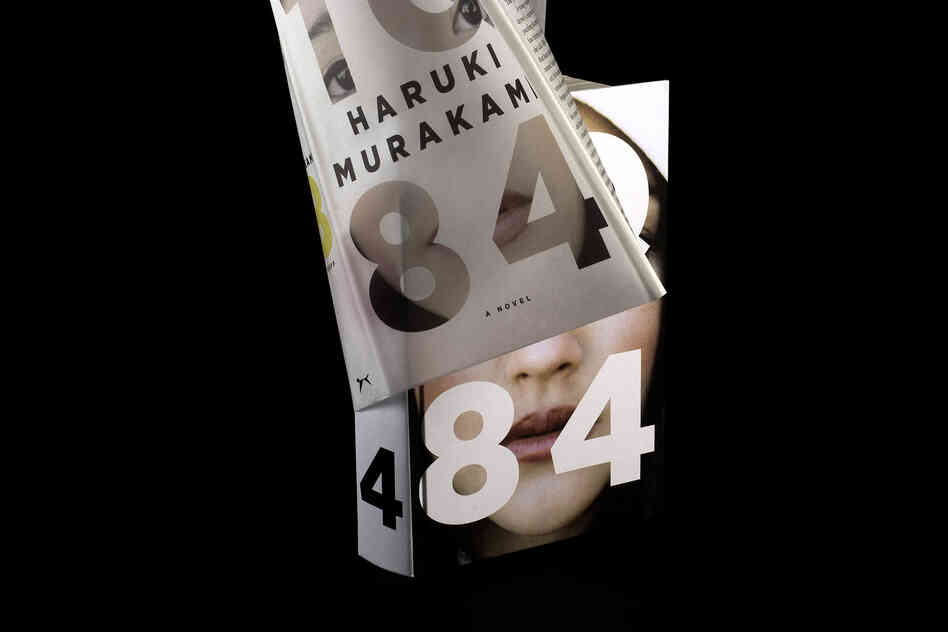 "The jacket is made of a semi-transparent vellum and holds part of the woman's image within the lettering of the title. Underneath is the complimentary image on the binding, and together they 'complete the reality.' Even if you don't know anything about the book when you first see it, you are forced to consider the concept of one person 'stradling' two states of being."