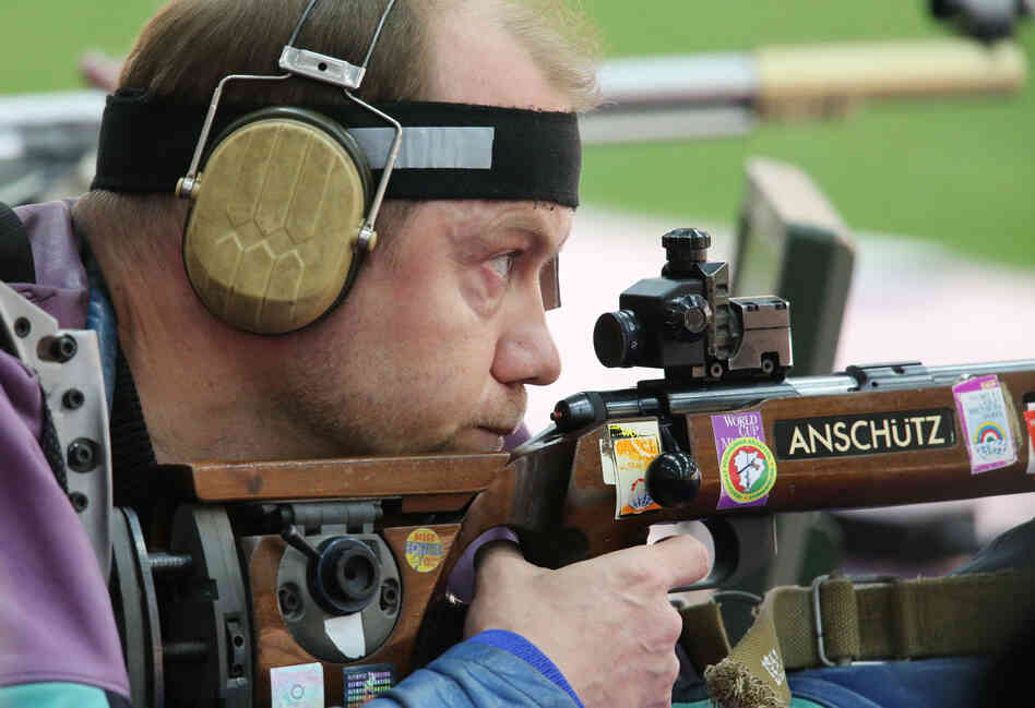 Sergei Martynov of Belarus competes in the men's 50m rifle prone shooting event. Martynov won the event.