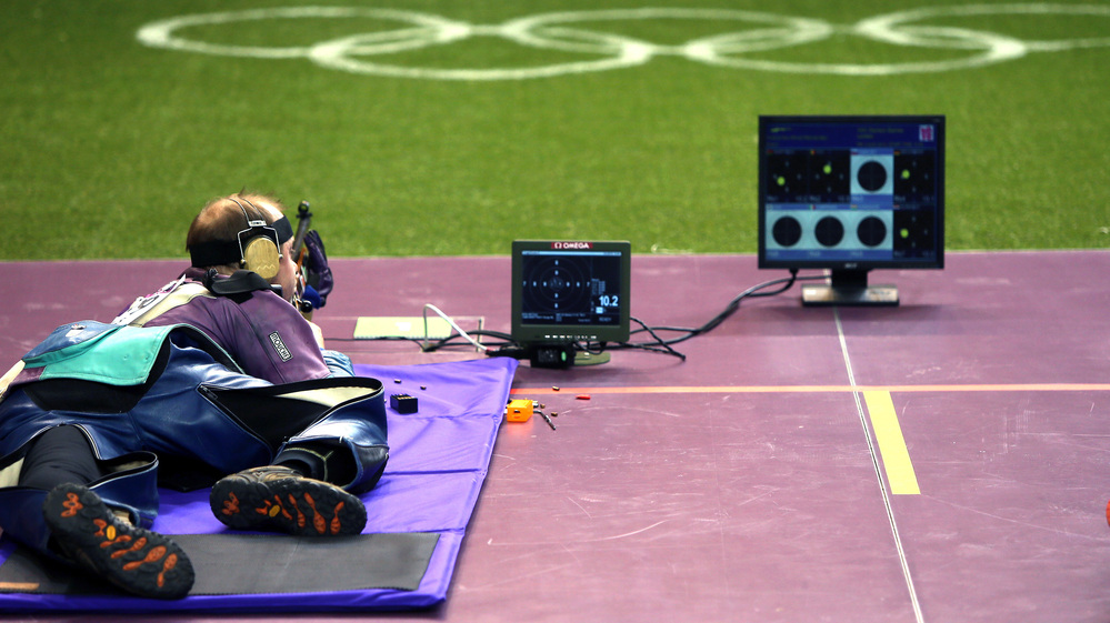 Gold medalist Sergei Martynov of Belarus competes in the 50m rifle prone final, in which he set a new world record, at the Royal Artillery Barracks in London.
