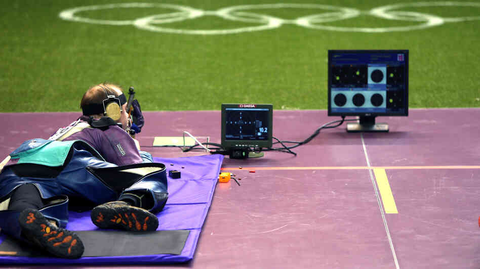 Gold medalist Sergei Martynov of Belarus competes in the 50m rifle prone final, in which he set a new world record, at the Royal Artillery Barracks in London.