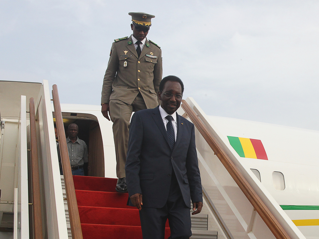 Mali's interim president, Dioncounda Traore, disembarks from a plane at Bamako airport last month. Traore returned to Bamako amid tight security following a two-month stay in Paris for medical treatment after being savagely beaten in the aftermath of the country's coup.