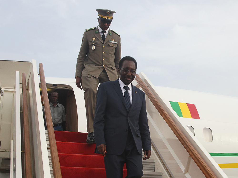 Mali's interim president, Dioncounda Traore, disembarks from a plane at Bamako airport last month. Traore returned to Bamako amid tight security following a two-month stay in Paris for medical treatment after being savagely beaten in the aftermath of the country's coup.