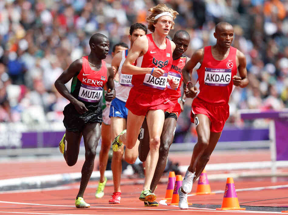 Evan Jager of the United States and Tarik Langat Akdag of Turkey lead their men's 3000m steeplechase heat, on Day 7 of the London 2012 Olympic Games.