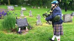 Bagpipe player Dave Olson makes visiting the grave part of his regular routine.