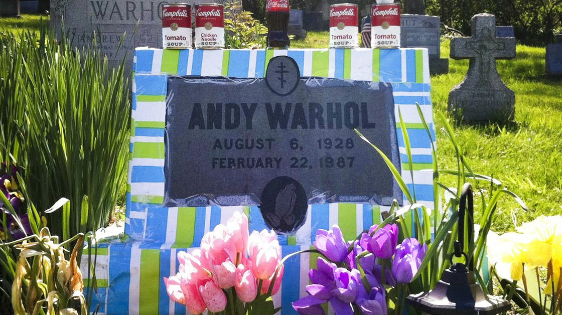 Fans leave all manner of mementos at Andy Warhol's grave site, near Pittsburgh. This spring, a local Warhol impersonator wrapped the grave stone in colorful paper for an entire month.