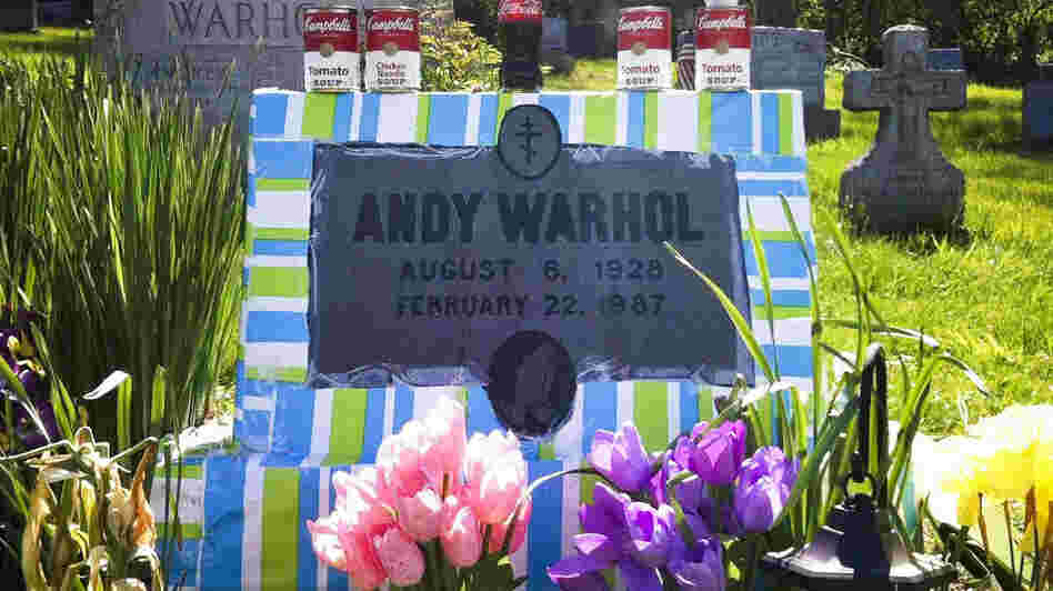 Fans leave all manner of mementos at Andy Warhol's grave site, near Pittsburgh. This spring, a local Warhol impersonator wrapped the grave stone in colorful paper for an entire month.