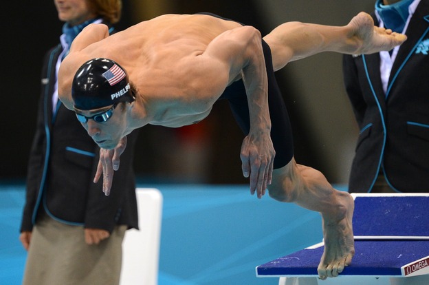 One more time: American swimmer Michael Phelps dives in to swim the butterfly leg of the men's medley relay Saturday. Phelps' team won the Olympic gold medal, giving him 22 overall and 18 gold when he leaves the London Games.