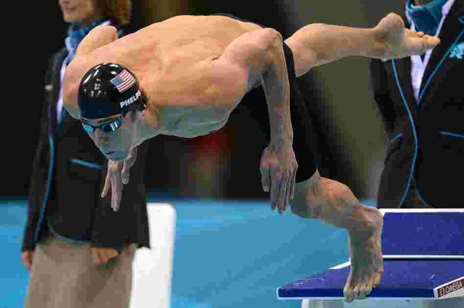 One more time: American swimmer Michael Phelps dives in to swim the butterfly leg of the men's medley relay Saturday. Phelps' team won the Olympic gold medal, giving him 22 overall and 18 gold when he leaves the London Games.