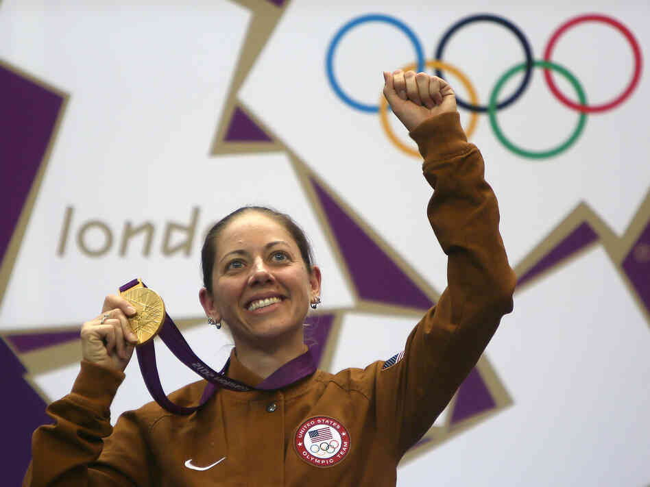 American gold medalist Jamie Lynn Gray celebrates on the podium after winning the 50m rifle 3 positions women final at the Royal Artillery Barracks in London.