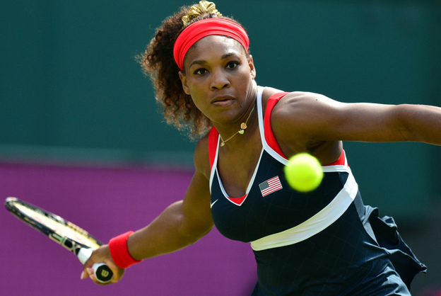 Serena Williams hits a return to Russia's Maria Sharapova during their final tennis match in the 2012 London Olympic Games at the All England Tennis Club in Wimbledon. Williams won, 6-0, 6-1.