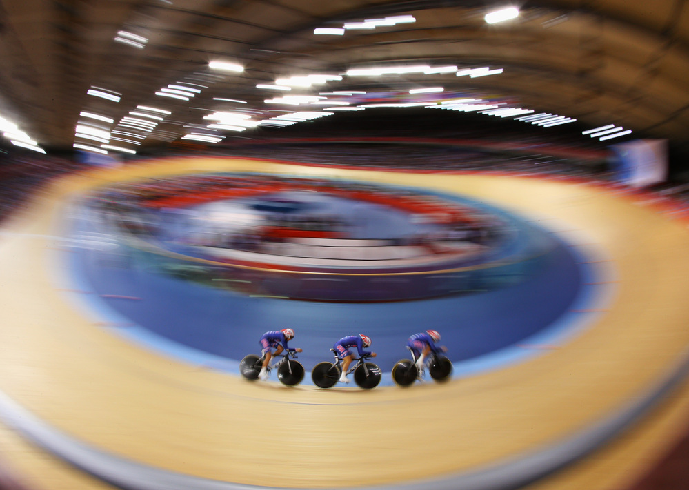 Dotsie Bausch, Jennie Reed and Sarah Hammer of the United States ride in a heat against Australia on Day 8 of the London 2012 Olympic Games at the Velodrome in London, England. The Americans took silver in the final.