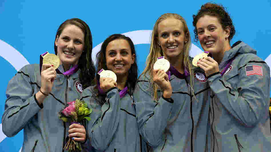 U.S. gold medallists (L-R) Missy Franklin, Rebecca Soni, Dana Volmer, and Allison Schmitt pose on the podium after their world-record 4x100m medley relay final.