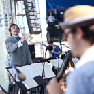 Darcy James Argue conducts his Secret Society at the 2012 Newport Jazz Festival. Darcy James Argue conducts his Secret Society at the 2012 Newport Jazz Festival.