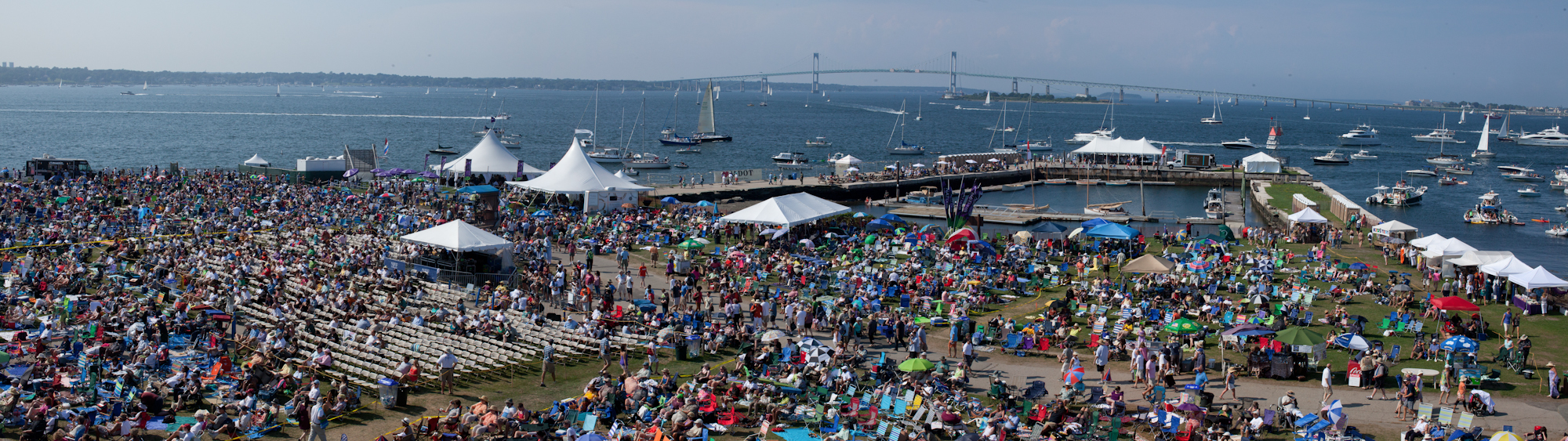 Concert goers take in the Narragansett Bay at Fort Adams State Park during the Newport Jazz Festival. 