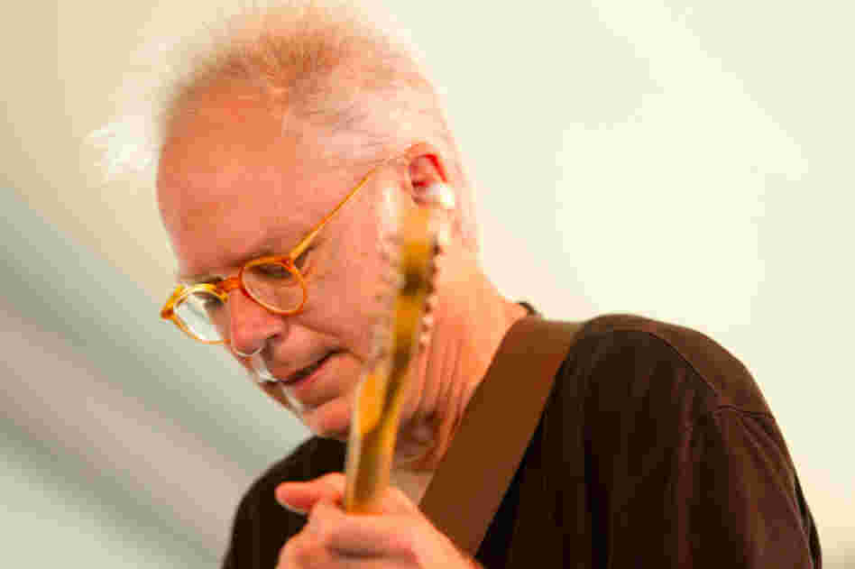 Guitarist Bill Frisell performs with The Bad Plus at the 2012 Newport Jazz Festival.
