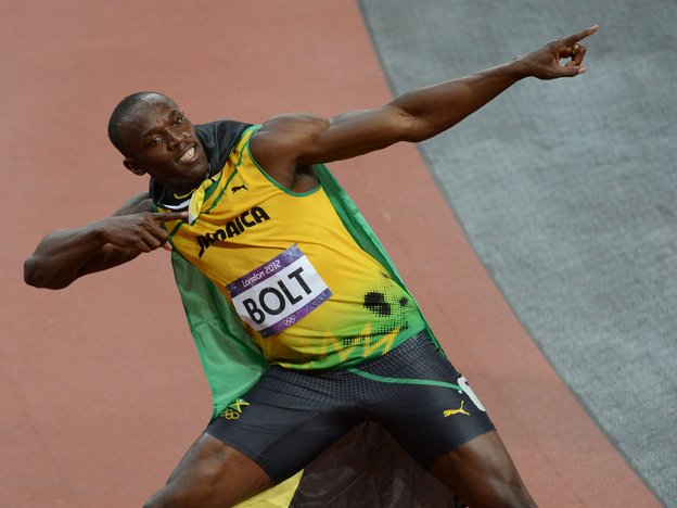 Jamaica's Usain Bolt celebrates after winning the men's 100m final at the London Games on Sunday.