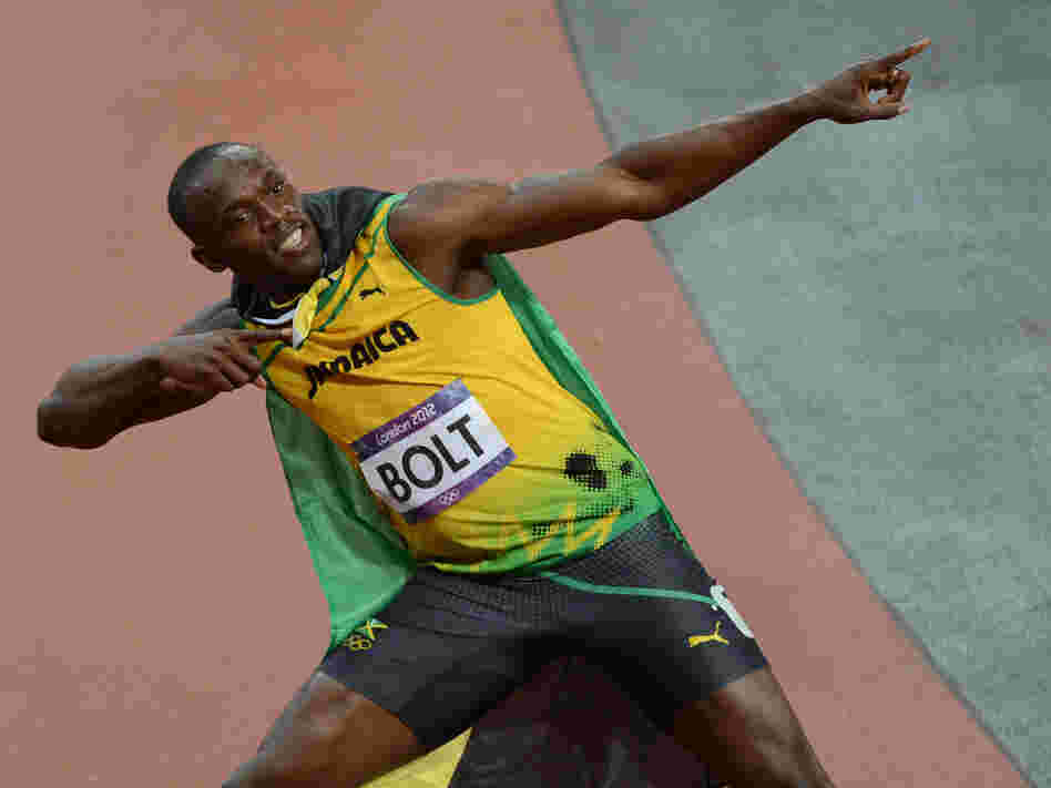 Jamaica's Usain Bolt celebrates after winning the men's 100m final at the London Games on Sunday.