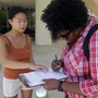 Aubrey Marks (left) helps a University of Central Florida student to register to vote in Orlando, Fla., on July 31.