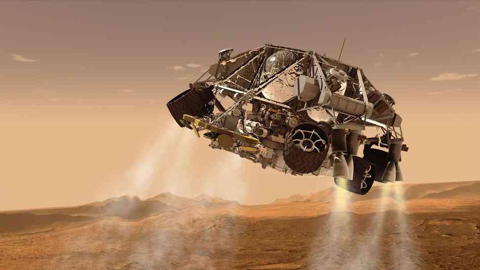An artist's concept of NASA's Mars Science Laboratory spacecraft depicts the final minute before the rover, Curiosity, touches down on the surface of Mars.