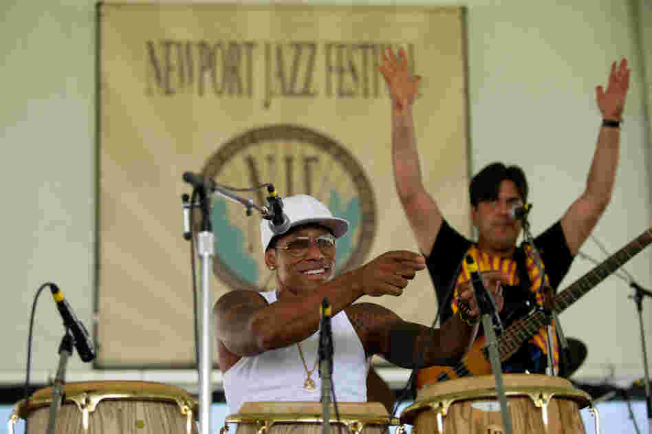 Before noon Saturday, the quartet led by charismatic conguero Pedrito Martinez had its audience gyrating to Afro-Cuban rhythms. Bassist Alfaro Benavides provides additional encouragement from the stage.