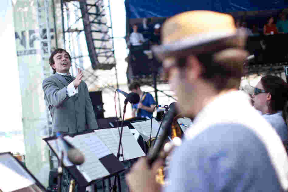 Sharply dressed for the occasion, composer Darcy James Argue led his 18-piece big band, Secret Society, at the main Fort Stage on Saturday.