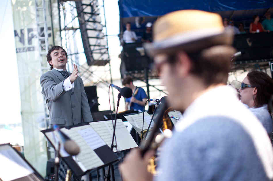 Sharply dressed for the occasion, composer Darcy James Argue led his 18-piece big band, Secret Society, at the main Fort Stage on Saturday.