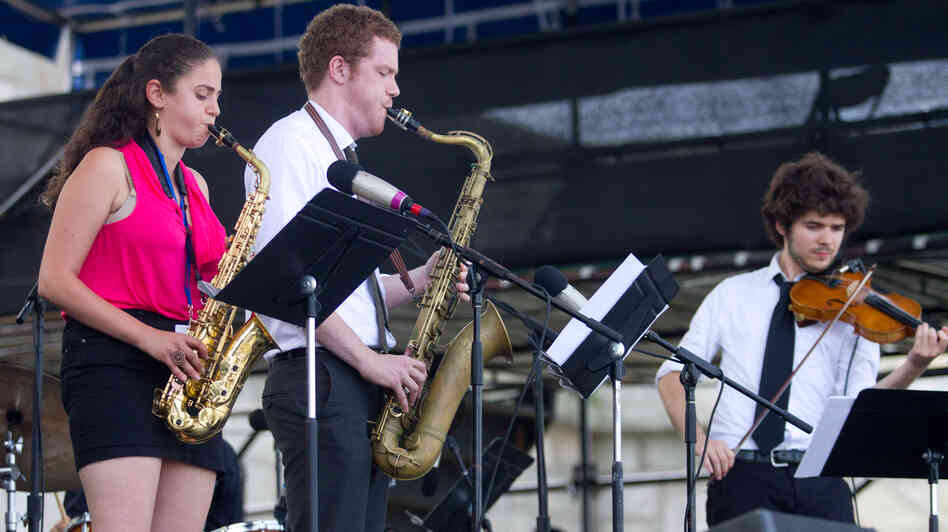 Saxophonists Lihi Haruvi (left) and Matthew Halpin (center) and violinist Alex Hargreaves (right) of The Berklee Global Jazz Ambassadors perform at the 2012 Newport Jazz Festival. Saxophonists Lihi Haruvi (left) and Matthew Halpin (center) and violinist Alex Hargreaves (right) of The Berklee Global Jazz Ambassadors perform at the 2012 Newport Jazz Festival.