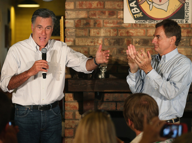 U.S. Senate candidate Richard Mourdock listens to Mitt Romney last week in Evansville, Ind.